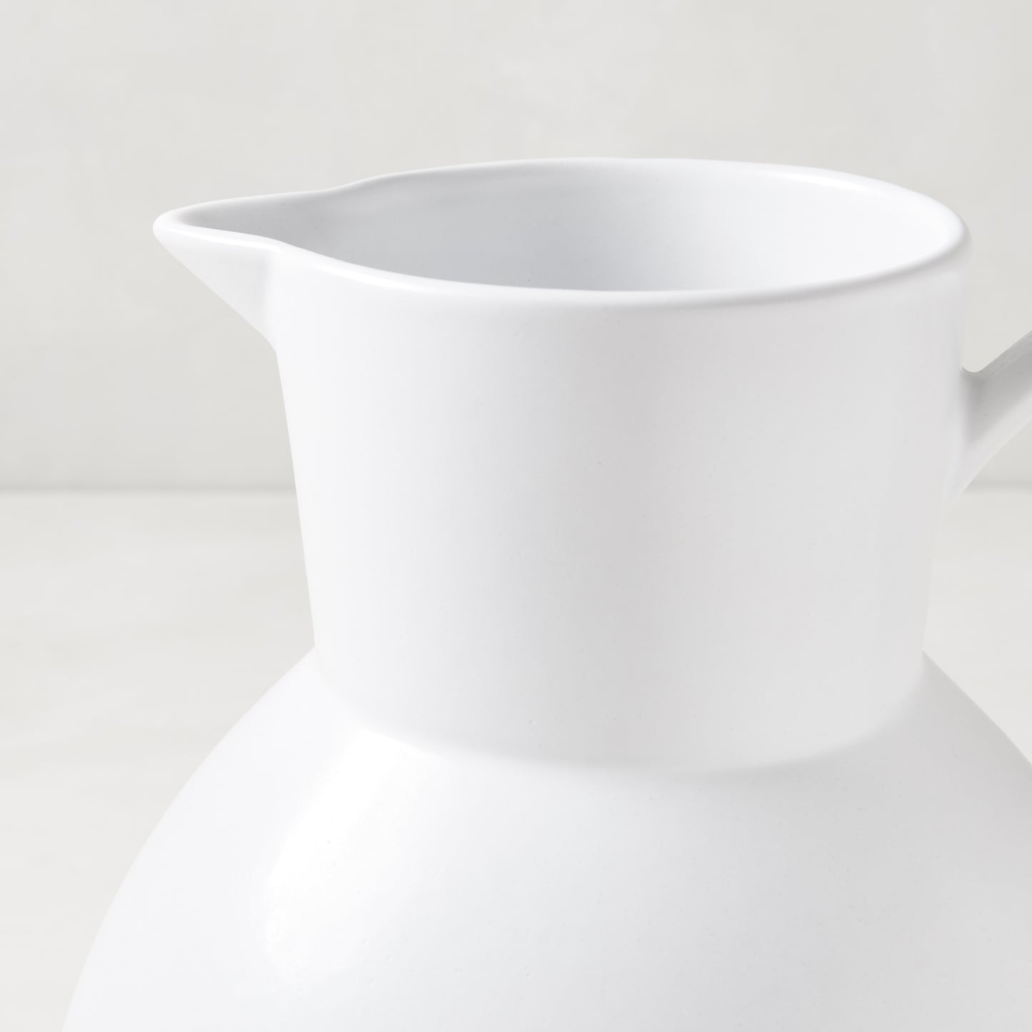 Diane Keaton + Hudson Grace sculptural white stoneware pitcher, oversized and handcrafted.