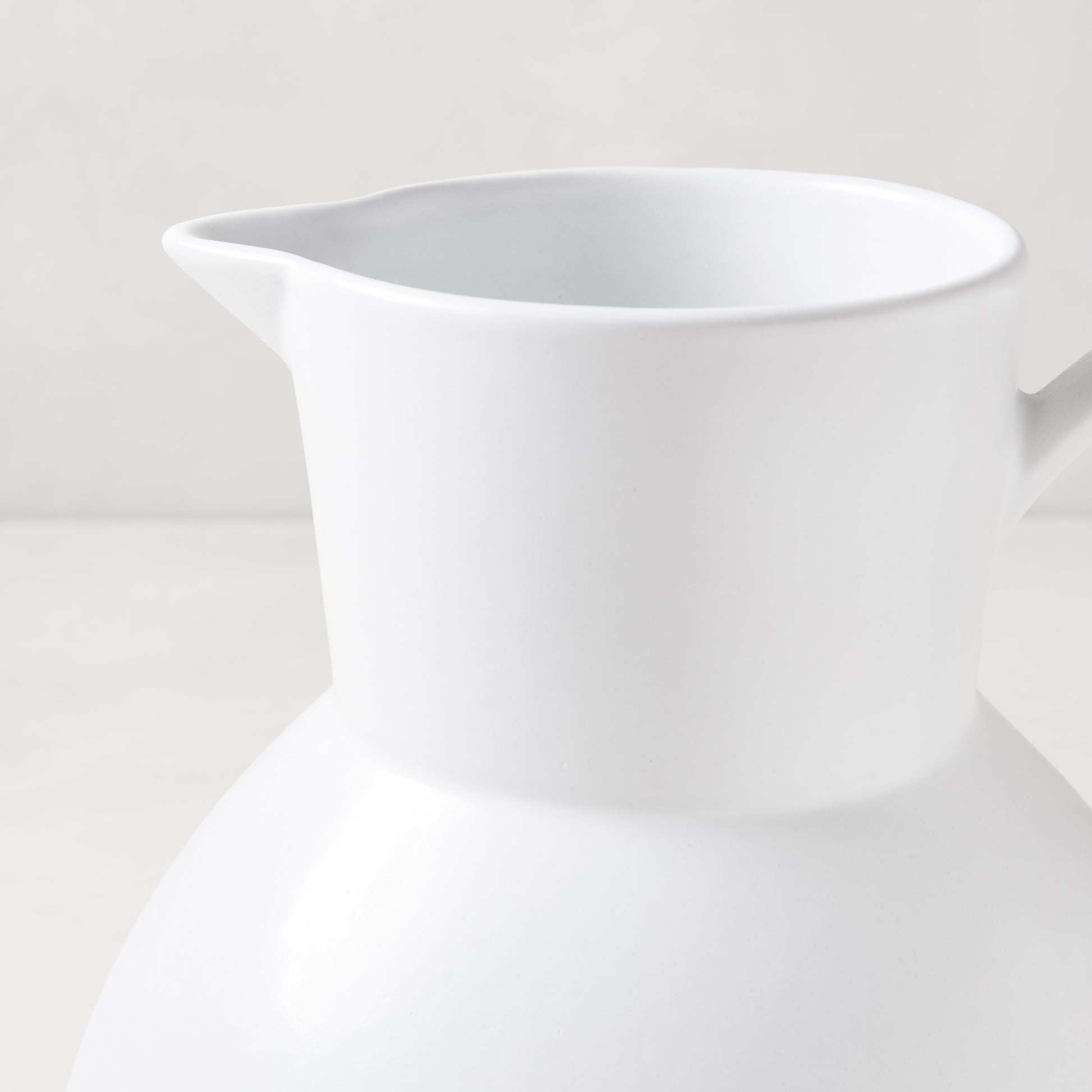 Diane Keaton + Hudson Grace sculptural white stoneware pitcher, oversized and handcrafted.
