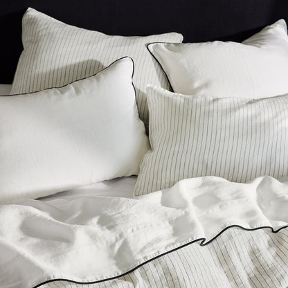 Diane Keaton + Hudson Grace white linen duvet cover and shams with black shirting stripes and piping.