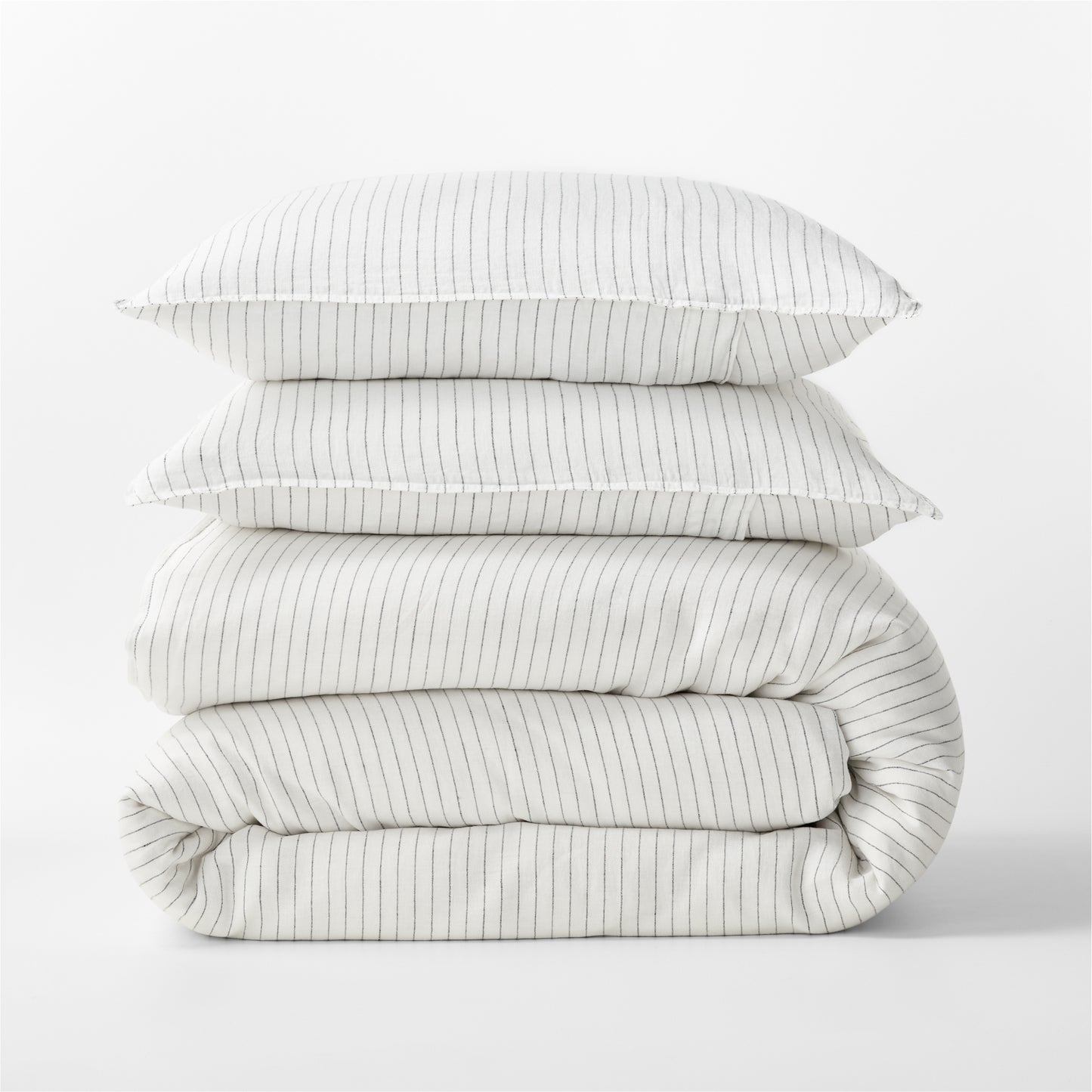 Diane Keaton + Hudson Grace Shirting Stripe Linen Duvet Cover set, folded, with two pillows.