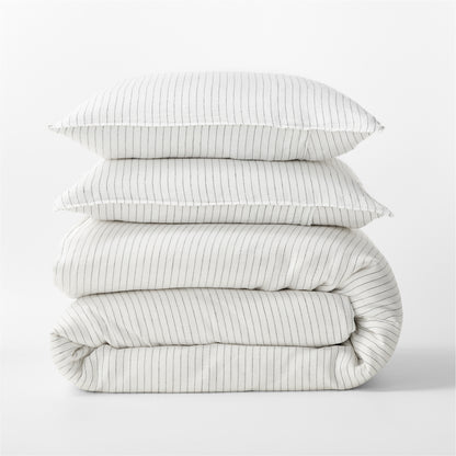 Diane Keaton + Hudson Grace Shirting Stripe Linen Duvet Cover set, folded, with two pillows.