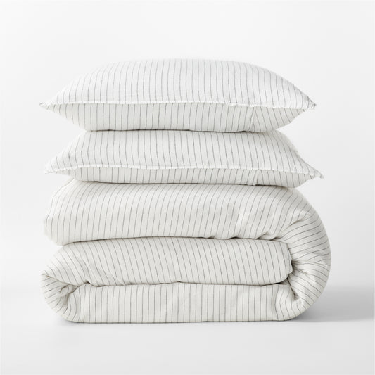 Diane Keaton + Hudson Grace Shirting Stripe Linen Duvet Cover set, folded, with two pillows.