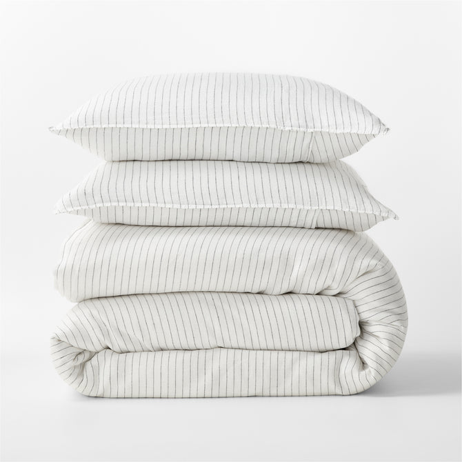 Diane Keaton + Hudson Grace Shirting Stripe Linen Duvet Cover set, folded, with two pillows.