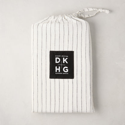 Diane Keaton x Hudson Grace Shirting Stripe Linen Shams, set of 2, in a white and black striped linen bag.