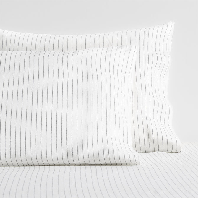 Diane Keaton + Hudson Grace white linen shams with thin black shirting stripes.