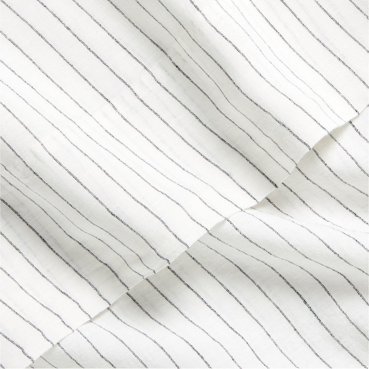 Diane Keaton x Hudson Grace Shirting Stripe Linen Sheet Set, white with thin black stripes.