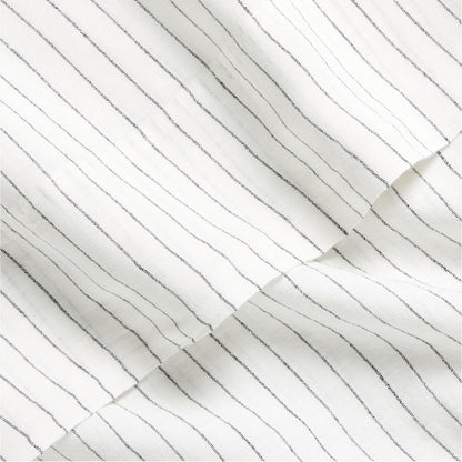 Diane Keaton x Hudson Grace Shirting Stripe Linen Sheet Set, white with thin black stripes.