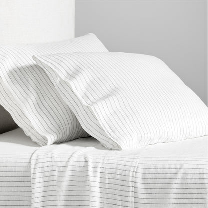 Diane Keaton x Hudson Grace Shirting Stripe Linen Sheet Set, white with thin black stripes.