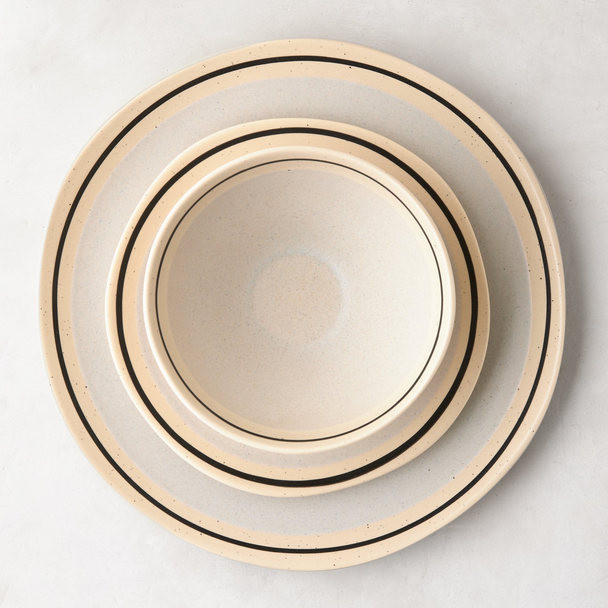 Diane Keaton + Hudson Grace Sketch stoneware dinner plate and bowl with black line detail.