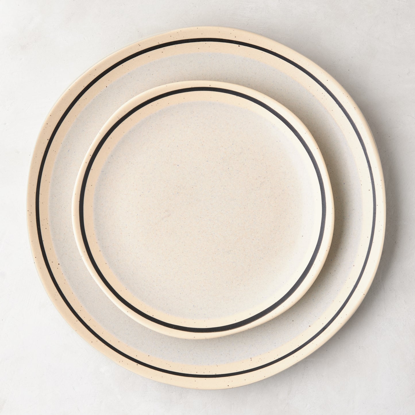 Diane Keaton + Hudson Grace Sketch Stoneware Dinner Plate, natural speckled finish with black line detail.