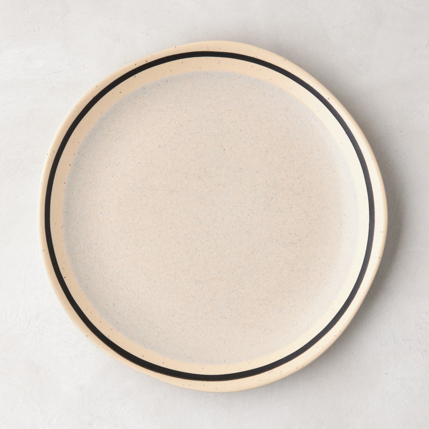 Diane Keaton + Hudson Grace speckled stoneware salad plate with black hand-drawn line.