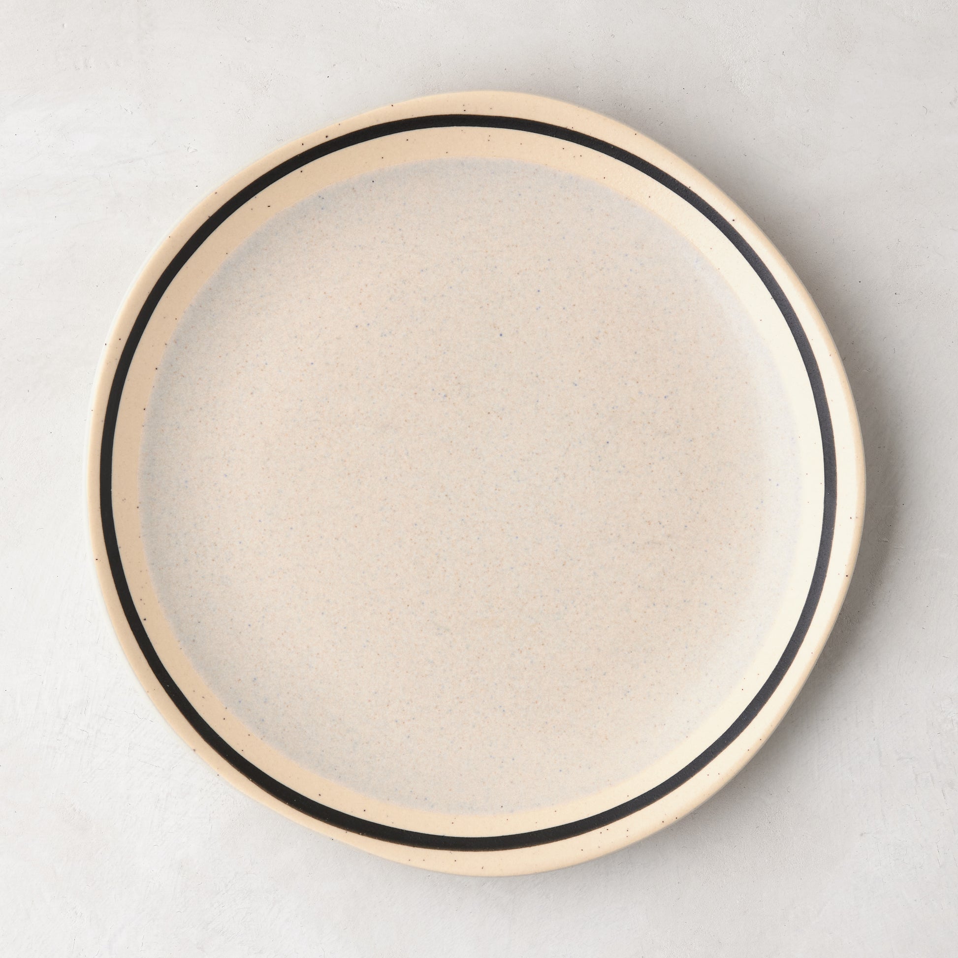 Diane Keaton + Hudson Grace speckled stoneware salad plate with black hand-drawn line.