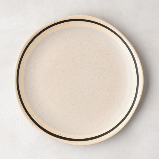 Diane Keaton + Hudson Grace speckled stoneware salad plate with black hand-drawn line.