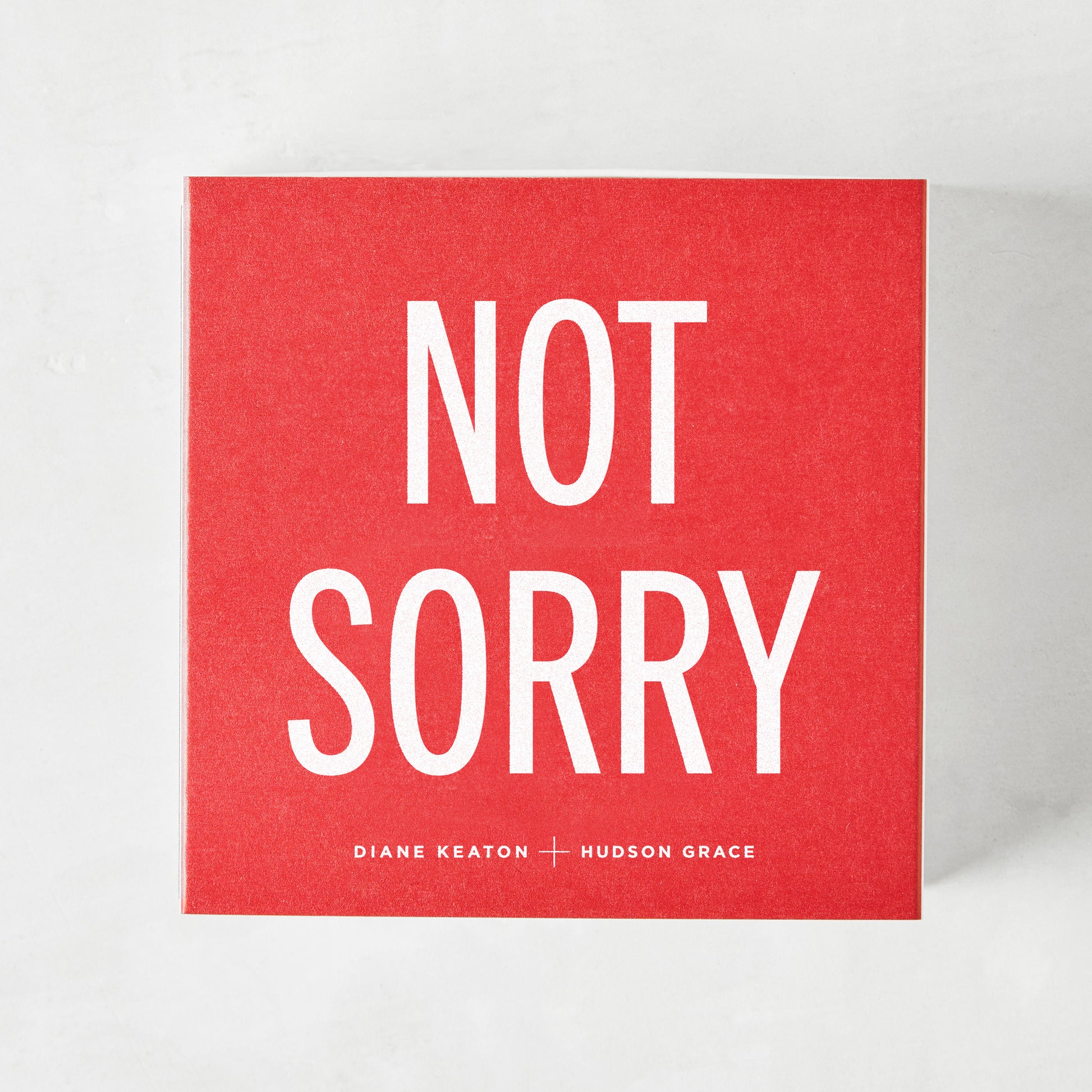 Diane Keaton + Hudson Grace "Sorry, Not Sorry" red boxed matches with white text.
