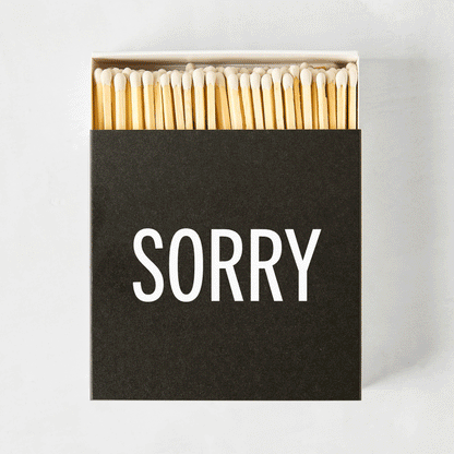 Diane Keaton + Hudson Grace "Sorry" boxed matches, black box with white text, natural wood matches.