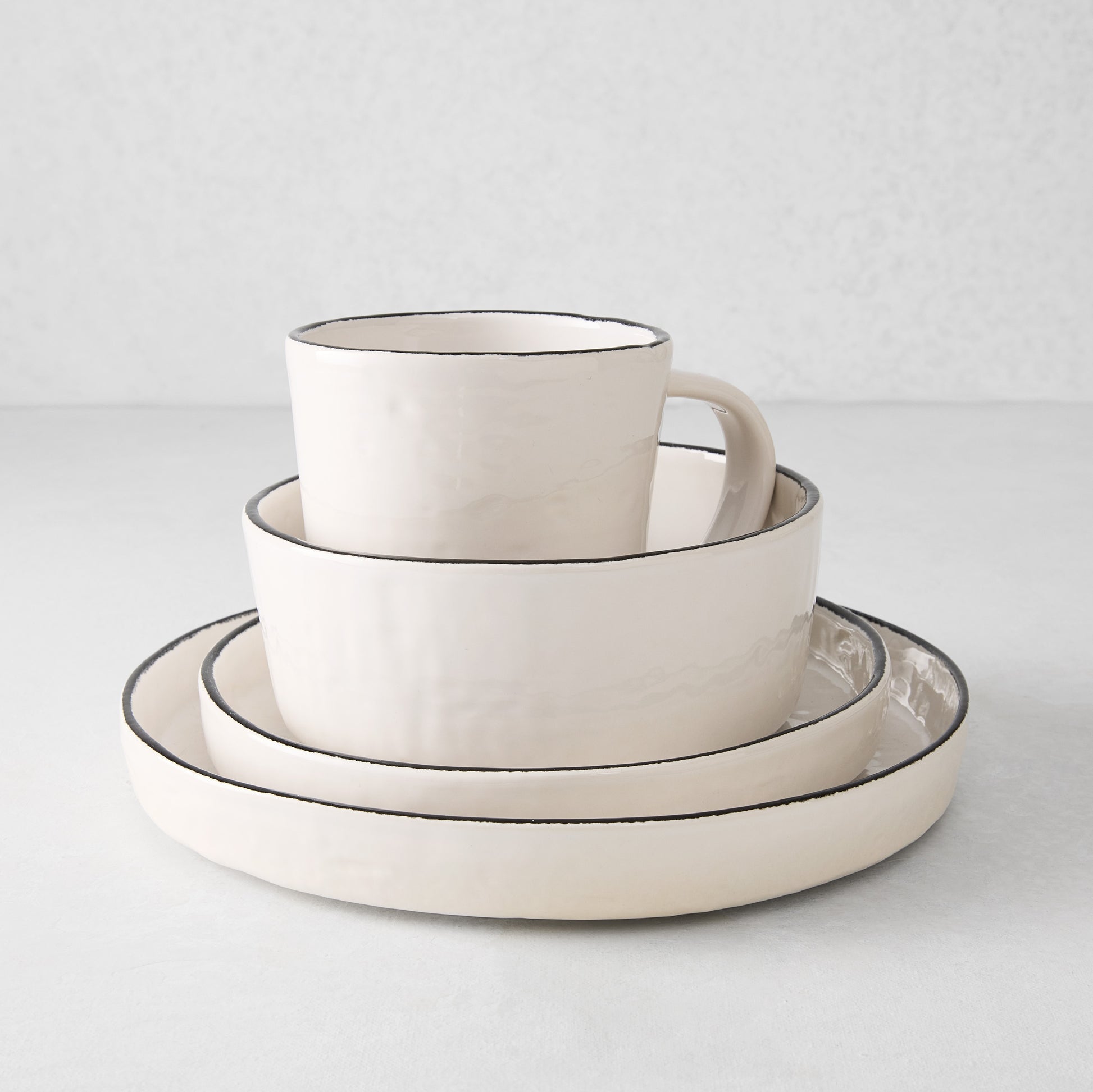 Diane Keaton + Hudson Grace Studio black rim stoneware salad plate, bowl, and mug set.
