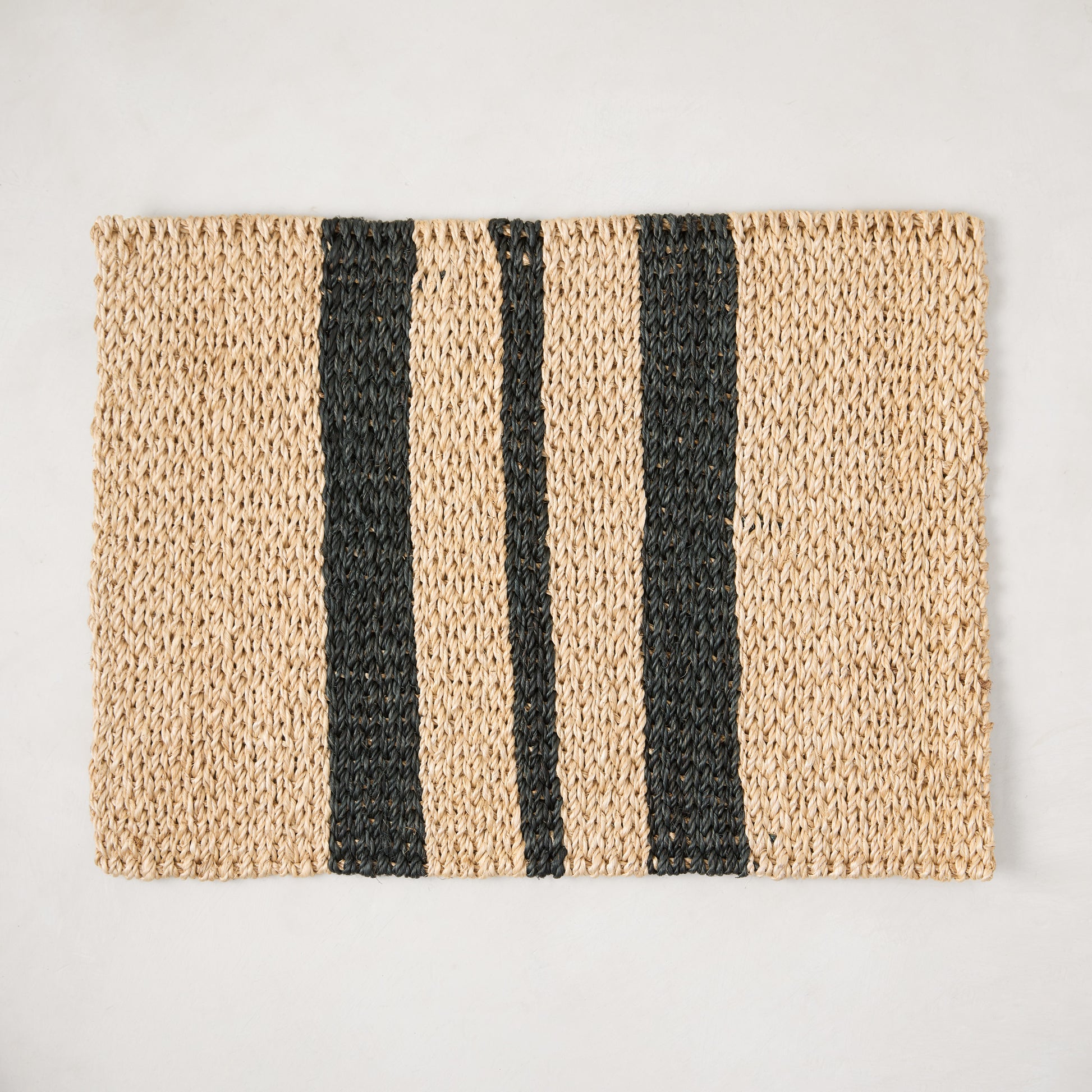 Diane Keaton + Hudson Grace tan and black abaca stripe woven placemat.
