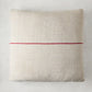 Diane Keaton + Hudson Grace vintage grain sack square pillow, natural linen-cotton with a single red stripe.