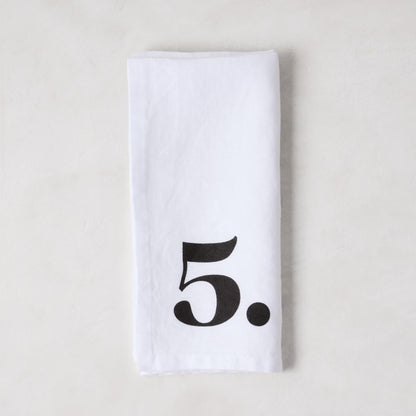 Diane Keaton + Hudson Grace white linen napkin with a bold black number 5.