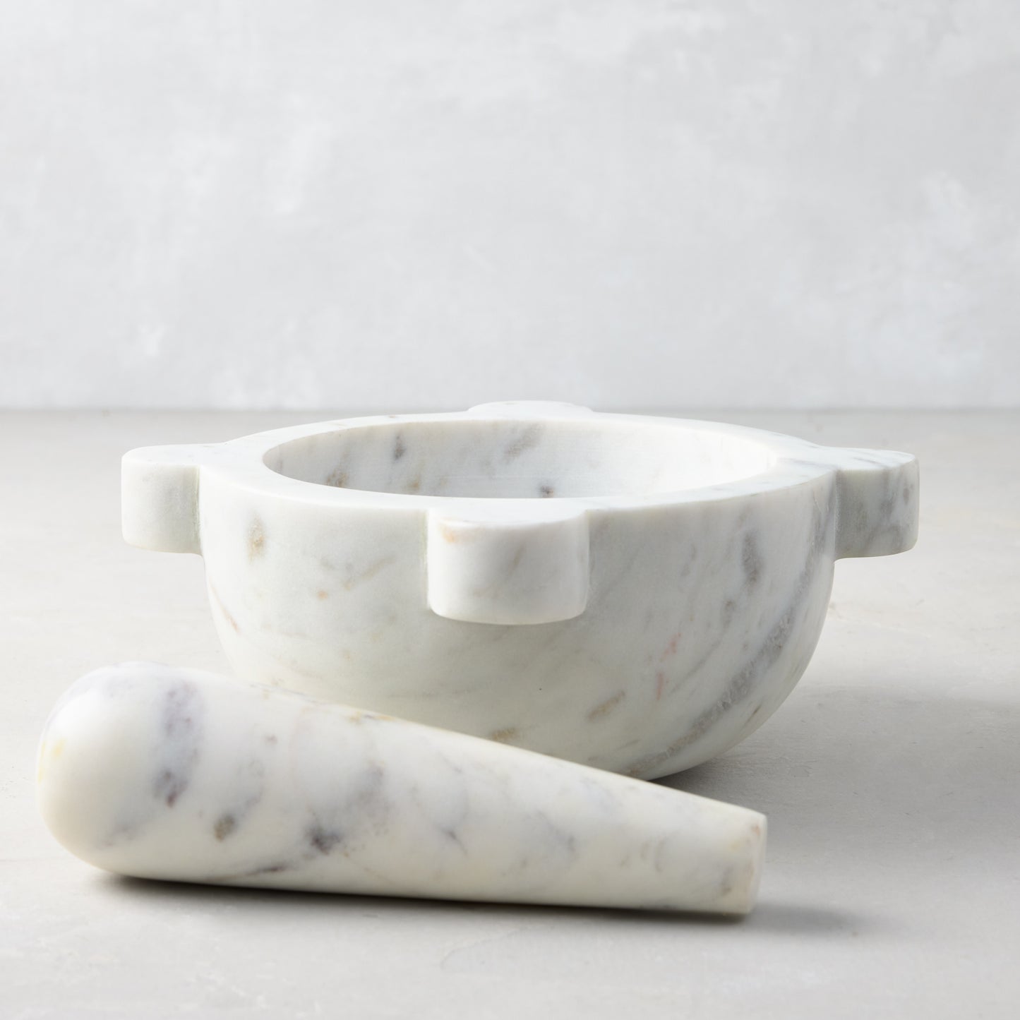 Diane Keaton + Hudson Grace white marble mortar and pestle with natural gray veining.
