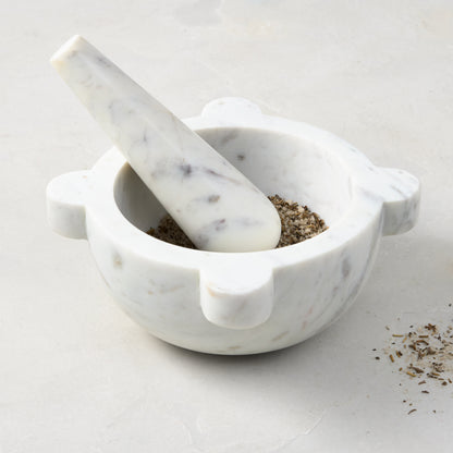 Diane Keaton + Hudson Grace white marble mortar and pestle with spices.