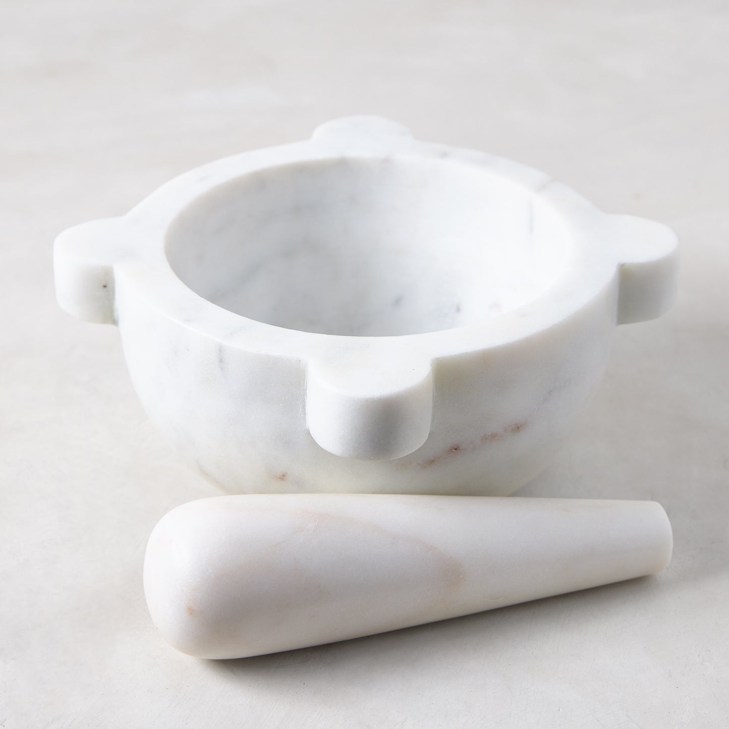 Diane Keaton + Hudson Grace white marble mortar and pestle with natural variations.