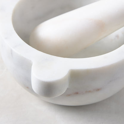 Diane Keaton + Hudson Grace white marble mortar and pestle, close-up.