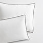 Set of 2 white washed linen shams with black piping, from the Diane Keaton x Hudson Grace Collection.