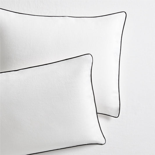 Set of 2 white washed linen shams with black piping, from the Diane Keaton x Hudson Grace Collection.