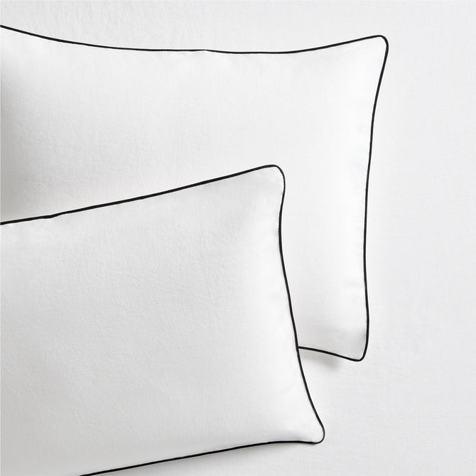 Set of 2 white washed linen shams with black piping, from the Diane Keaton x Hudson Grace Collection.