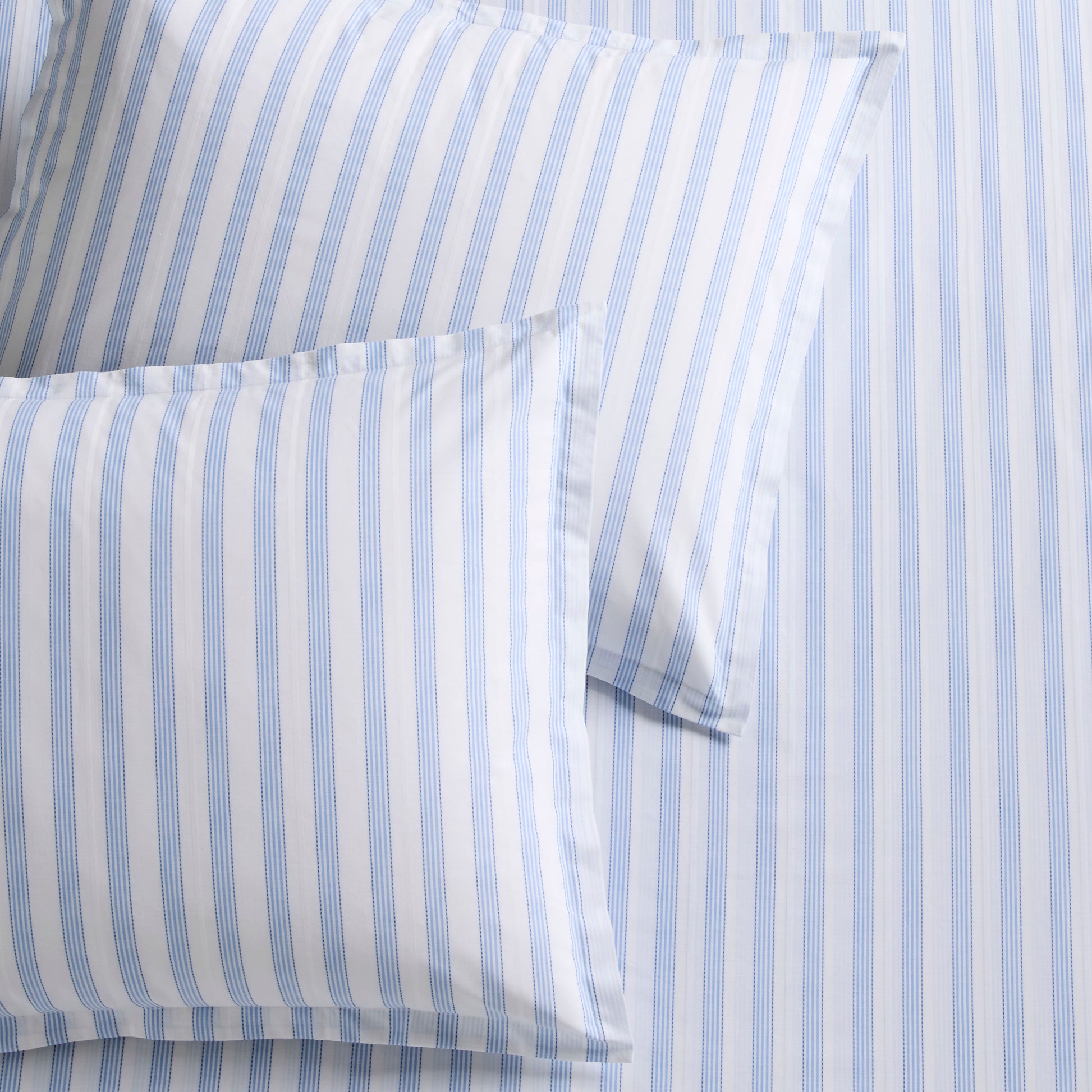 Dobby Blue Stripe Cotton Duvet Set with two shams, featuring subtle textured blue and white stripes.