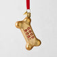 Gold glitter glass dog bone Christmas ornament with "GOOD DOG!" in red.