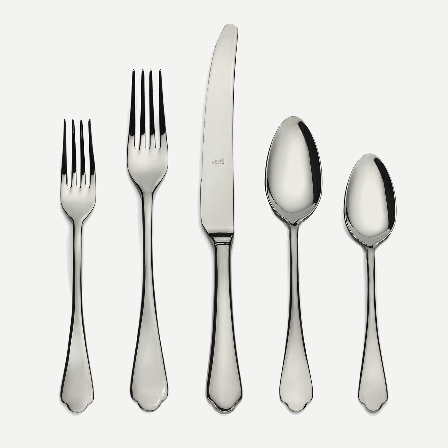 Dolce Vita 5-piece flatware set: shiny 18/10 stainless steel dinner knife, two forks, and two spoons.