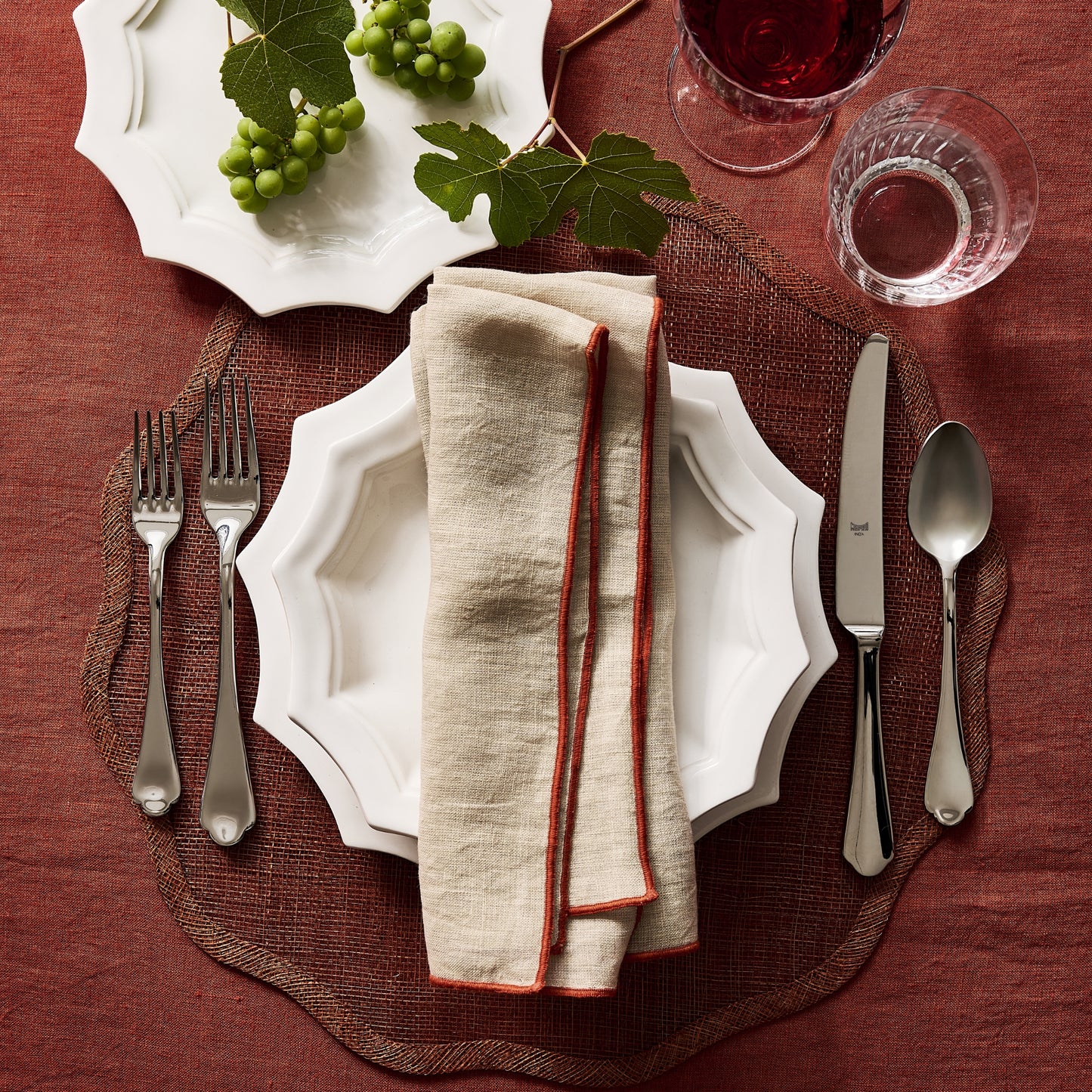 Dolce Vita 5-piece 18/10 stainless steel flatware set featuring elegant Neo-Baroque design on a rustic table setting.