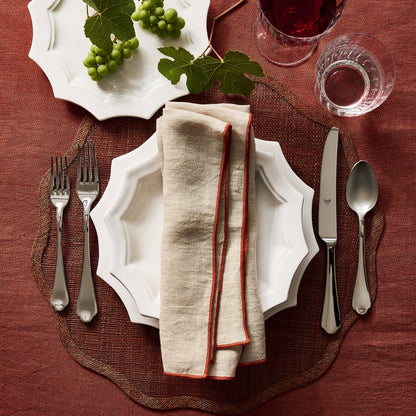 Dolce Vita 5-piece 18/10 stainless steel flatware set featuring elegant Neo-Baroque design on a rustic table setting.