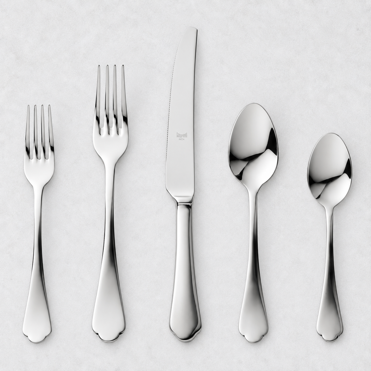 Dolce Vita 5-piece flatware set in polished 18/10 stainless steel with elegant Neo-Baroque design on a white background.