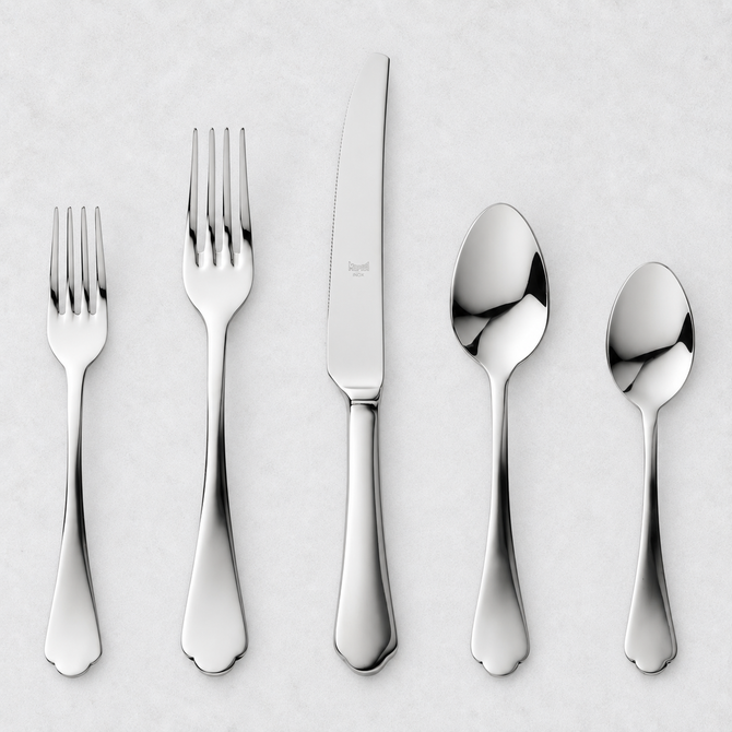 Dolce Vita 5-piece flatware set in polished 18/10 stainless steel with elegant Neo-Baroque design on a white background.