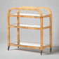 Dory Rattan Bar Cart: Honey-finished rattan bar cart with three glass tiers and wheels.