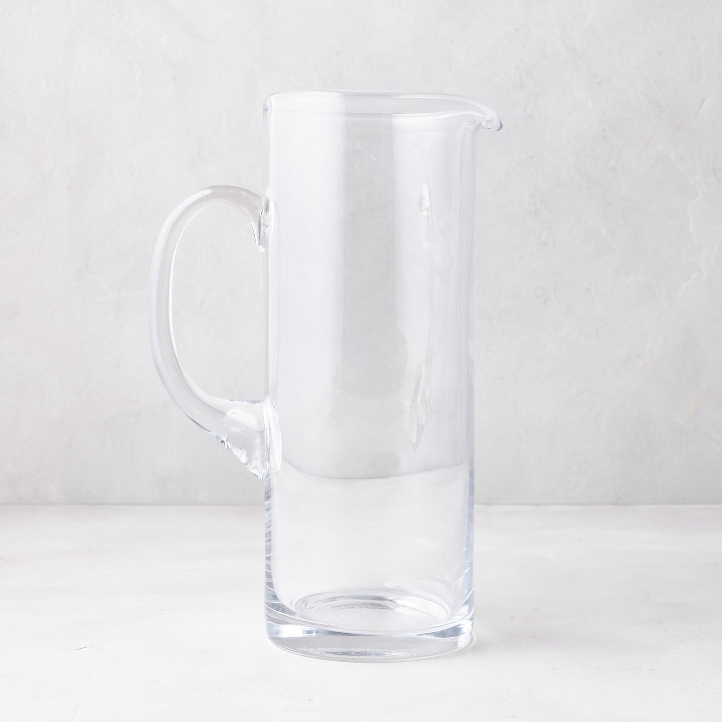 Downtown Tall Glass Bar Pitcher, clear, straight-sided design, with handle and pour spout.