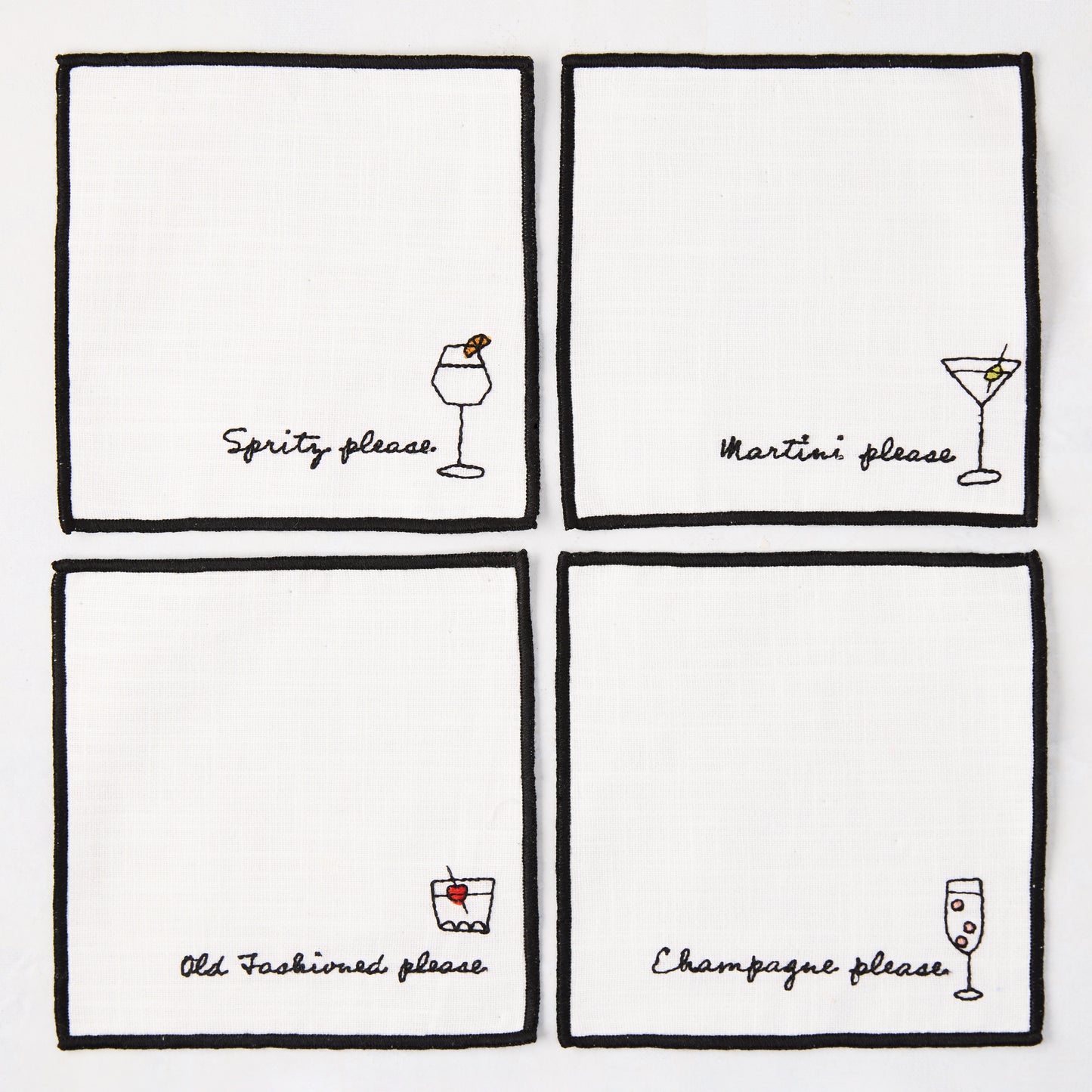 Set of 4 white cotton coasters with black embroidered cocktail designs: Spritz, Martini, Old Fashioned, Champagne.