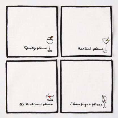 Set of 4 white cotton coasters with black embroidered cocktail designs: Spritz, Martini, Old Fashioned, Champagne.