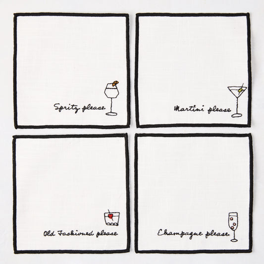 Set of 4 white cotton coasters with black embroidered cocktail designs: Spritz, Martini, Old Fashioned, Champagne.