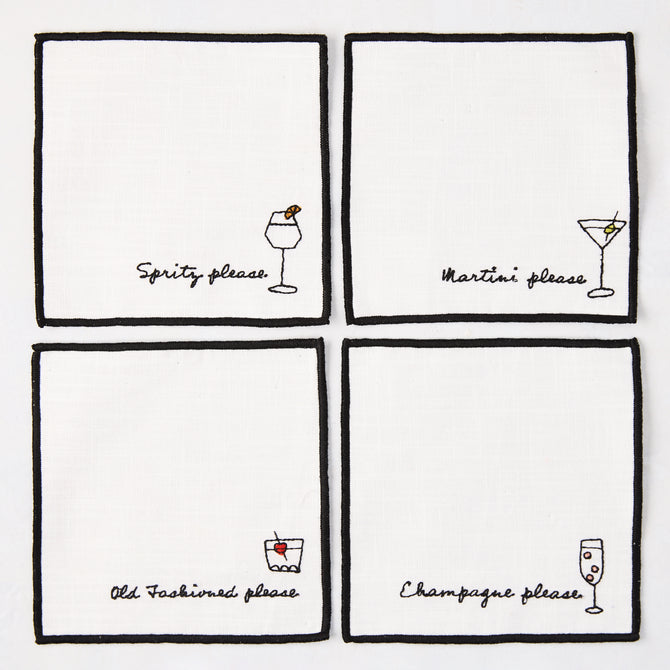 Set of 4 white cotton coasters with black embroidered cocktail designs: Spritz, Martini, Old Fashioned, Champagne.