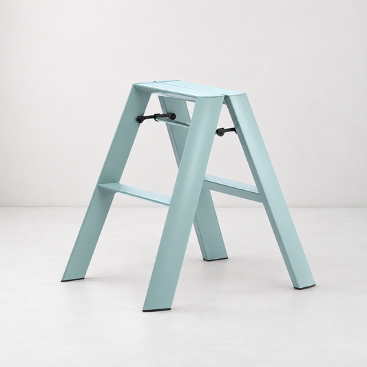 Dusty blue Hasegawa Lucano 2-step ladder in aluminum and steel with a matte finish and grooved treads.