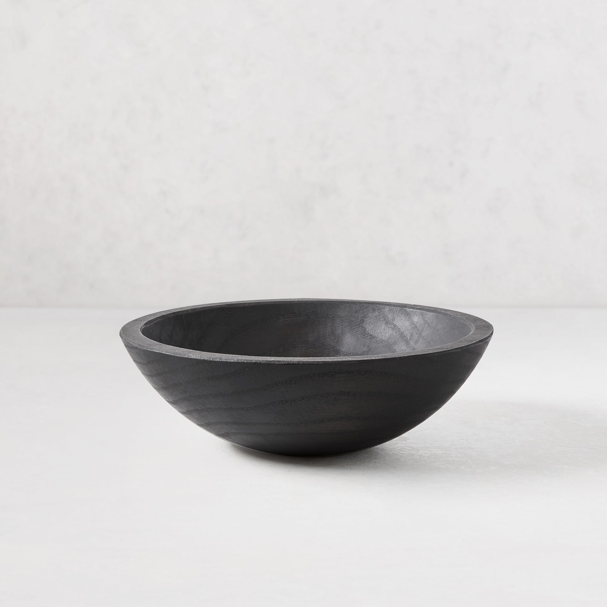 Ebonized wood bowl, 11" diameter, dark finish highlighting wood grain, handcrafted from spalted New England wood.