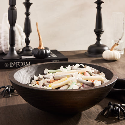 Ebonized wood bowl, 13", filled with colorful wrapped candies, on a dark wood table with Halloween decor.