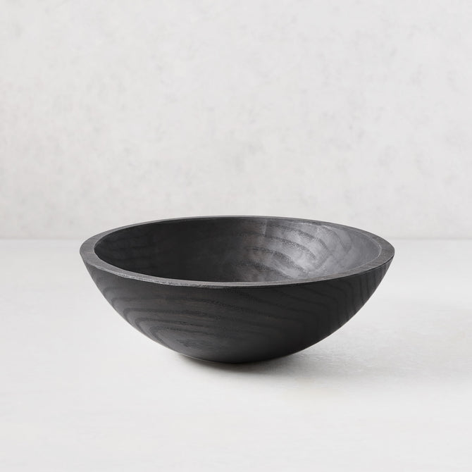 13" ebonized spalted wood bowl with dark, rich finish highlighting natural grain.