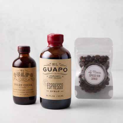 El Guapo Espresso Joie Kit with amber bottles of Spiced Cocoa Bitters, Espresso Syrup, and espresso beans.