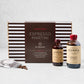 El Guapo Espresso Martini Cocktail Kit with striped box, espresso syrup, spiced cocoa, and coffee beans.