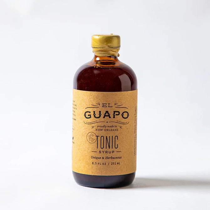 El Guapo Tonic Syrup in an 8.5 fl oz amber glass bottle with a kraft paper label and gold cap.
